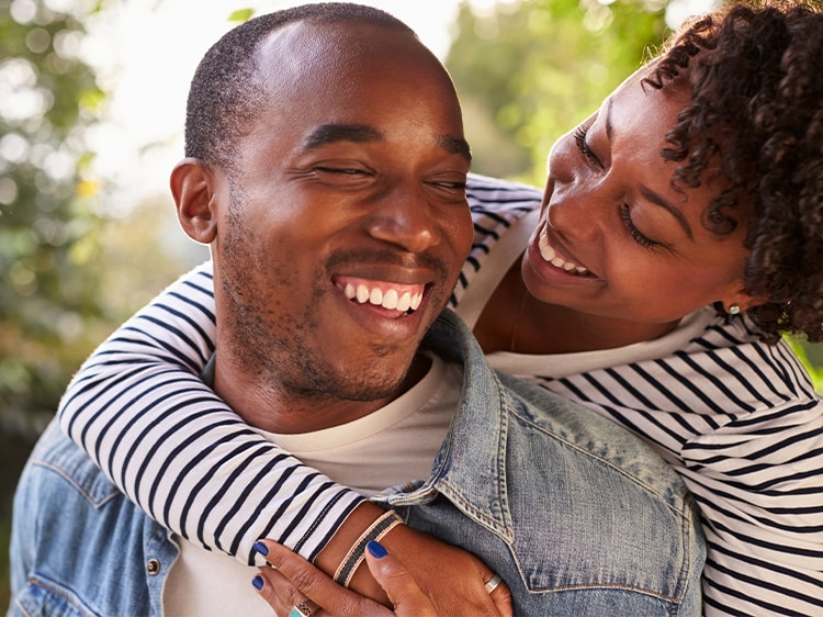 smiling couple hugging