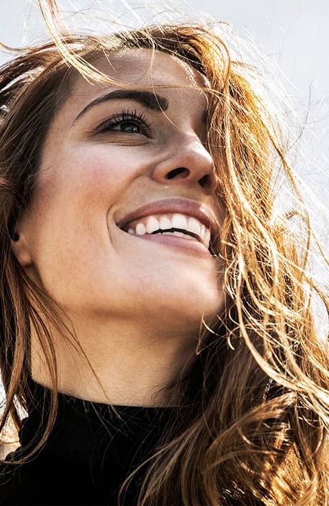 smiling woman showing white teeth