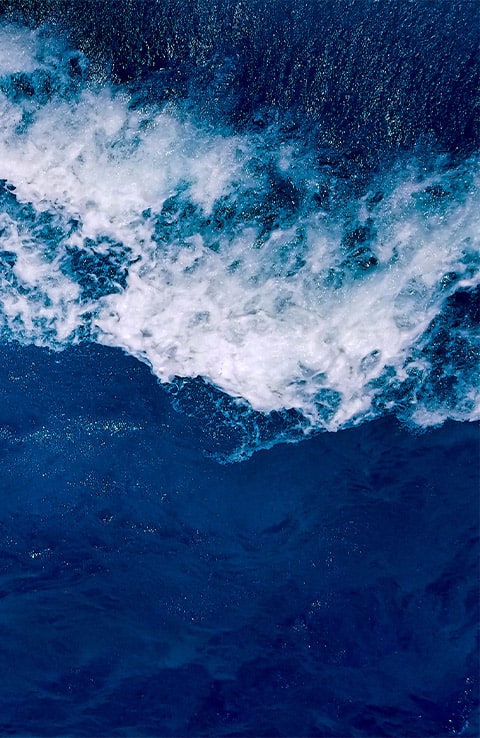 water washing up to a dark beach