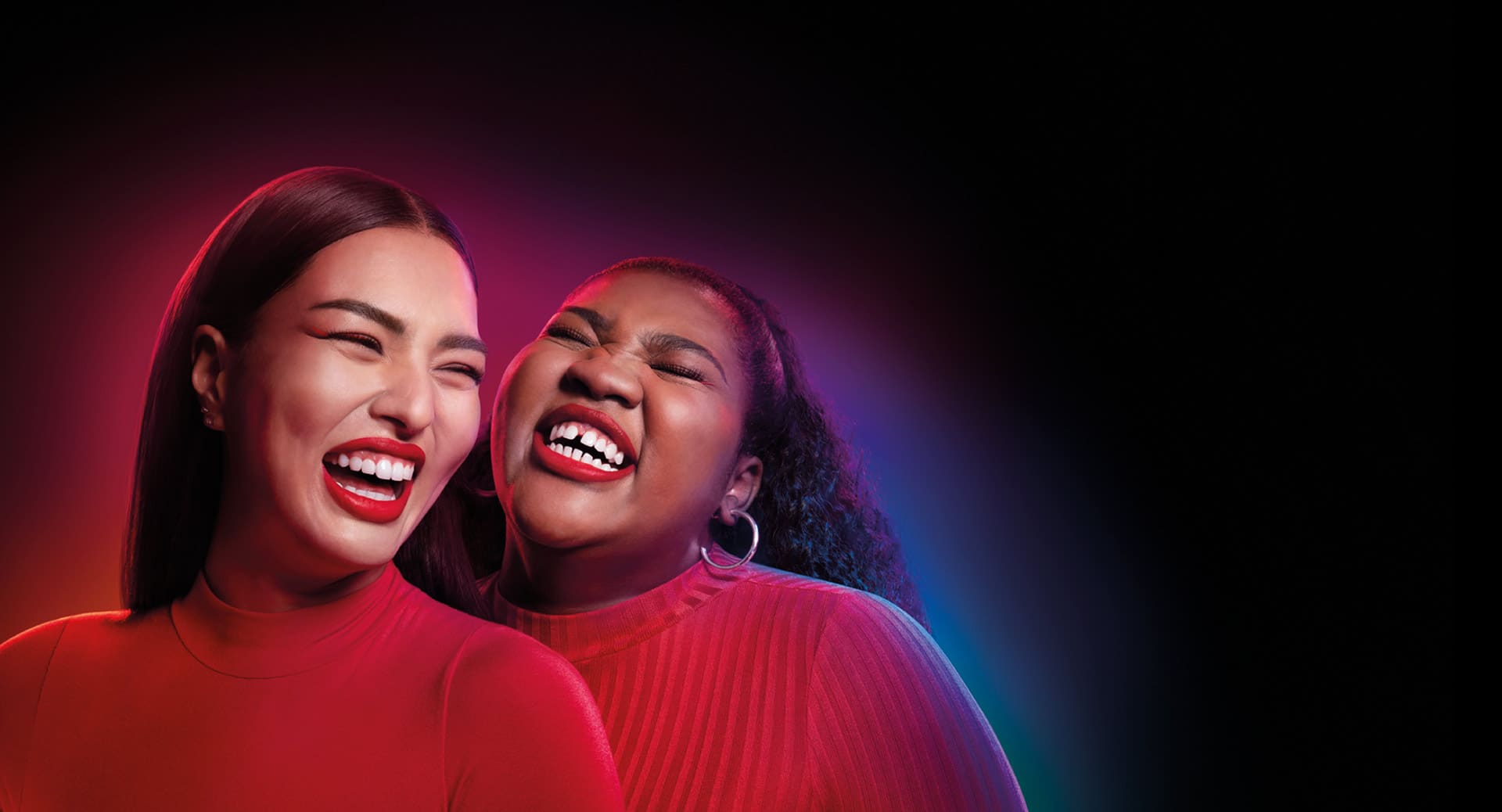 Ann and Suzie smiling out loud; image used for introducing Colgate's best teeth whitening product