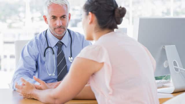 a patient talking to a doctor