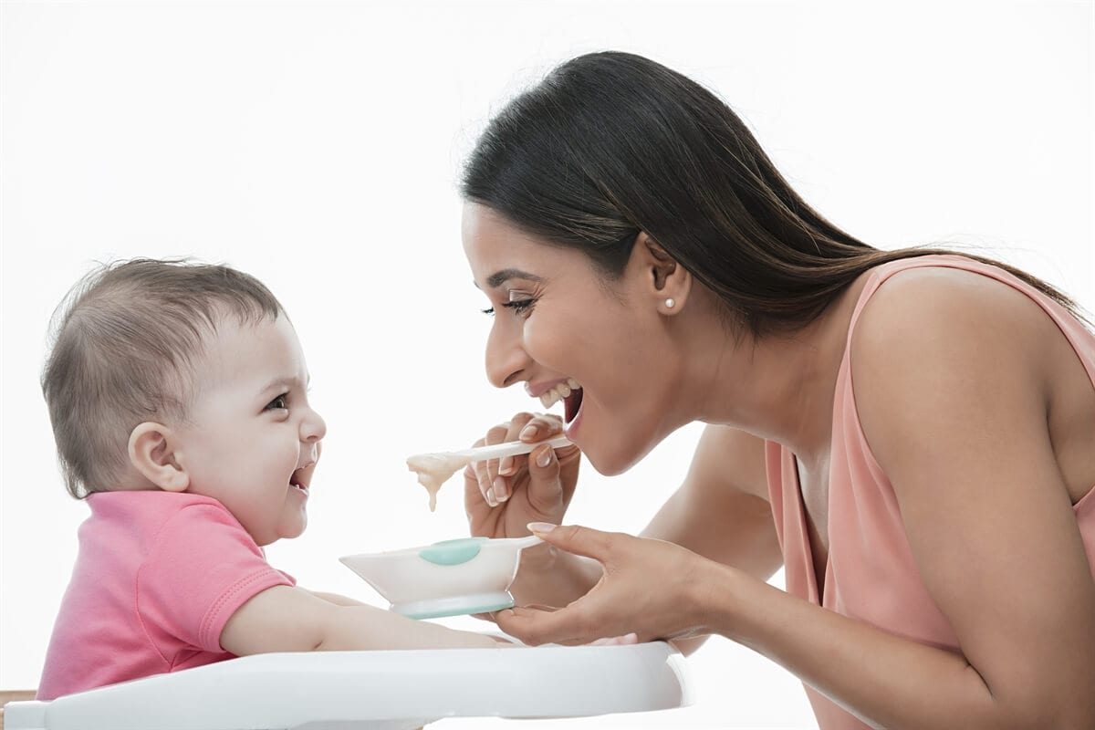 Woman feeding his baby