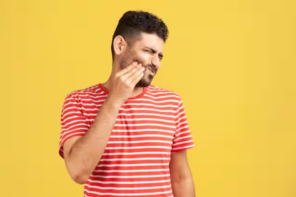 Man suffering from toothache in search of home remedies for tooth cavity
