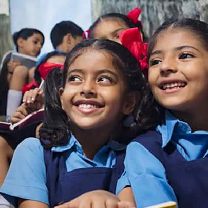 Young kids in school uniform with a bright smile