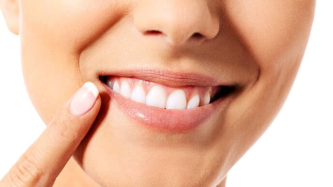 Woman demonstrating the effectiveness of baking soda for teeth