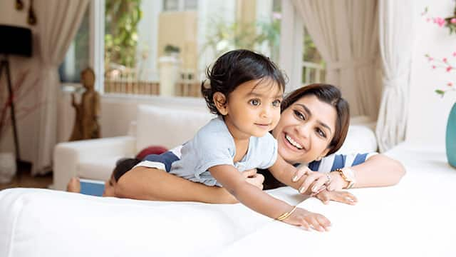 Cute little girl and her mother with healthy teeth