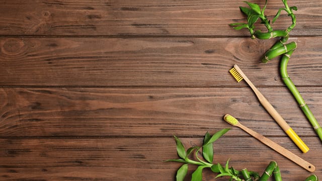 Two bamboo toothbrushes on the table