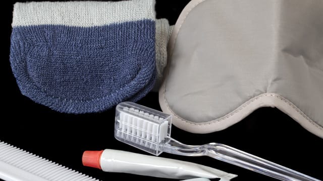 travel toiletries with toothbrush and toothpaste