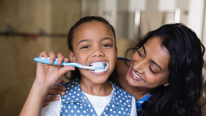 kids and dental cavities - three bad habits that could Be damaging - colgate in