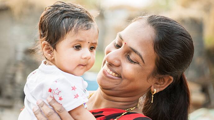 mom smiling with her baby