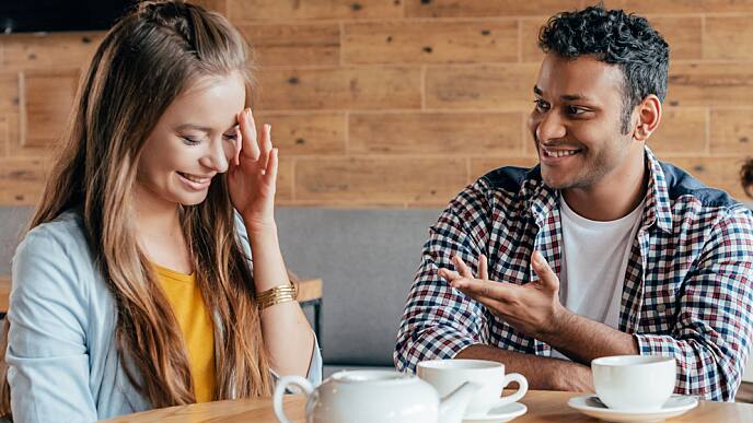 young man talking to a woman