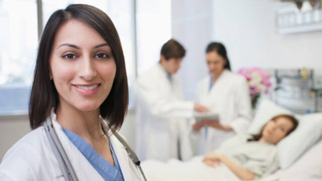 doctors smiling with a patient