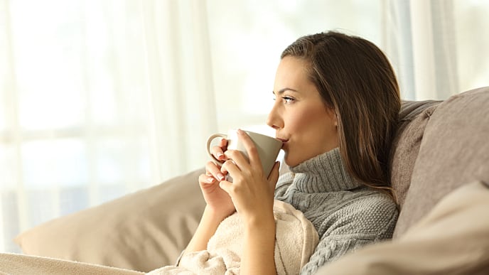 woman relaxing and drinking coffee
