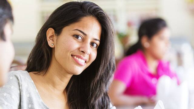 A young woman looking confident after tooth sensitivity treatment