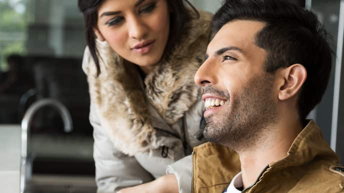 Couple smiling using Invisalign Braces