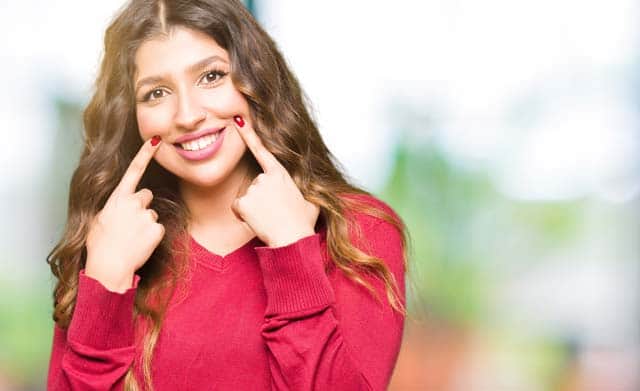 Woman with red lipstick to make teeth white