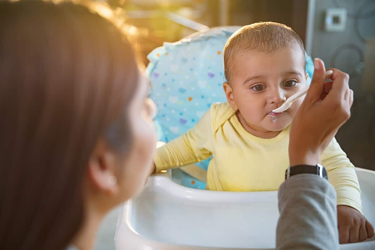 Woman feeding her baby