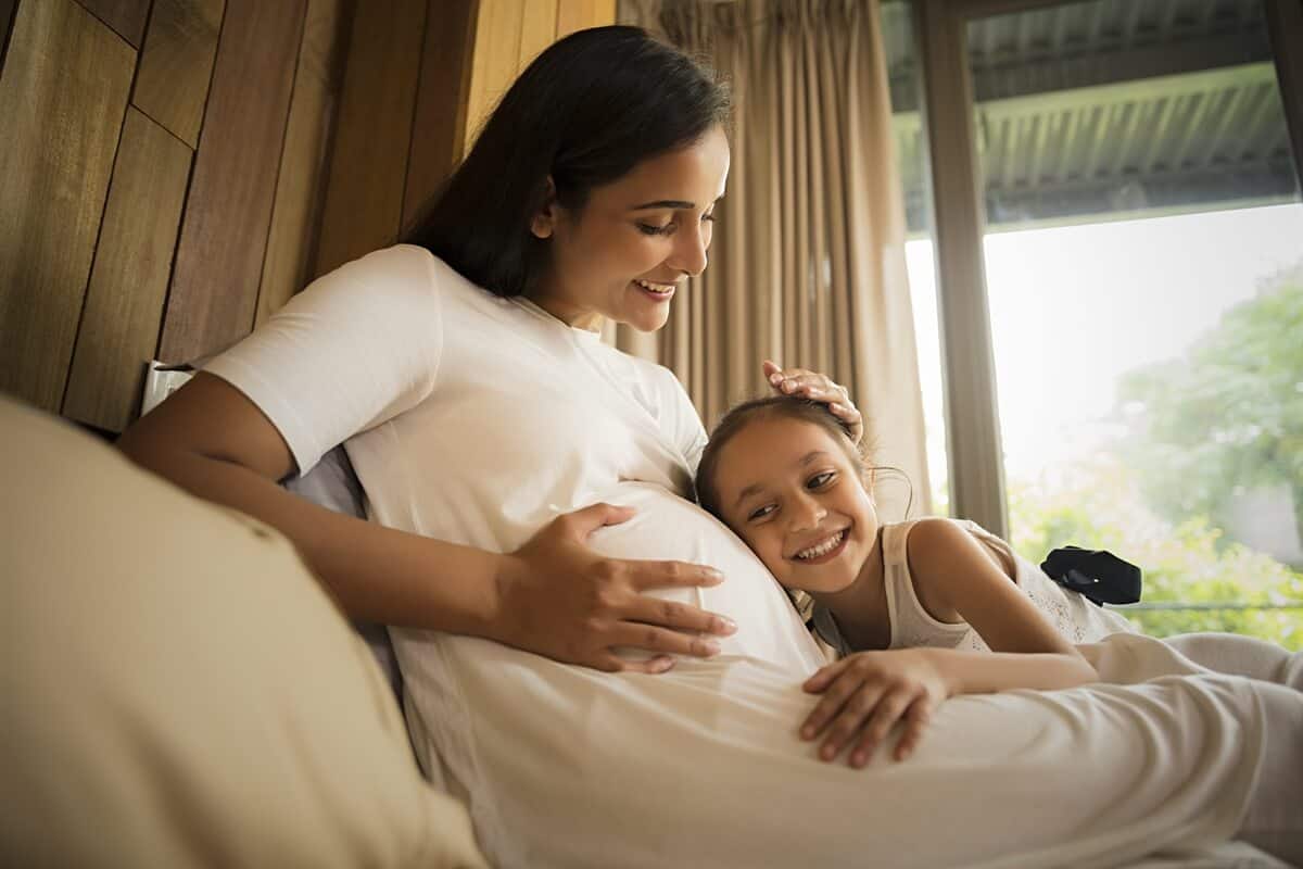 Pregnant woman with  her daughter