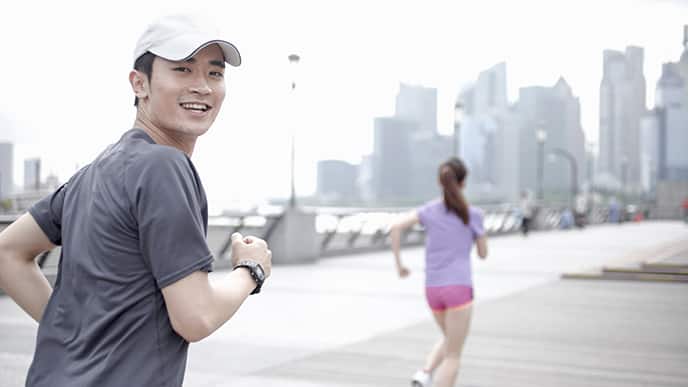 Asian couple running
