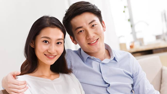 young Asian couple smiling