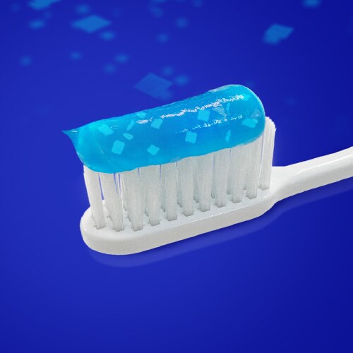 Toothpaste with cooling crystals on a brush head
