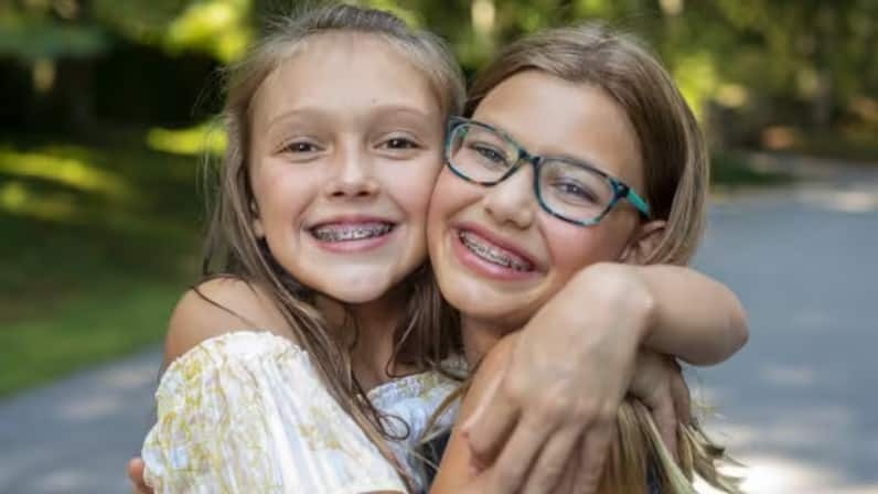 happy kids with teeth retainers