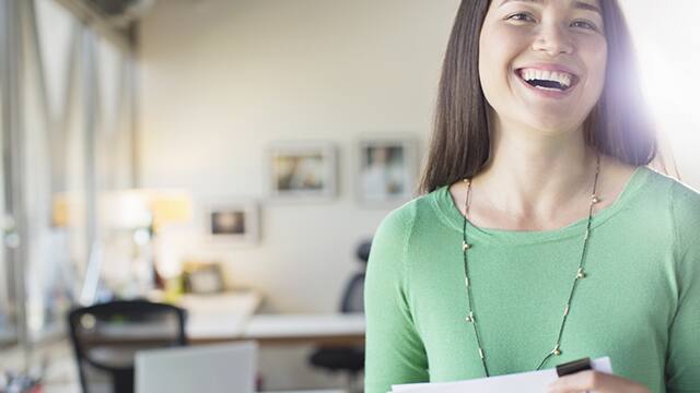 Girl smiling with a bright, radiant smile, showcasing the effects of teeth whitening serum