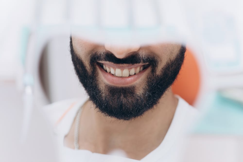 checking-their-teeth-mirror-after-dental