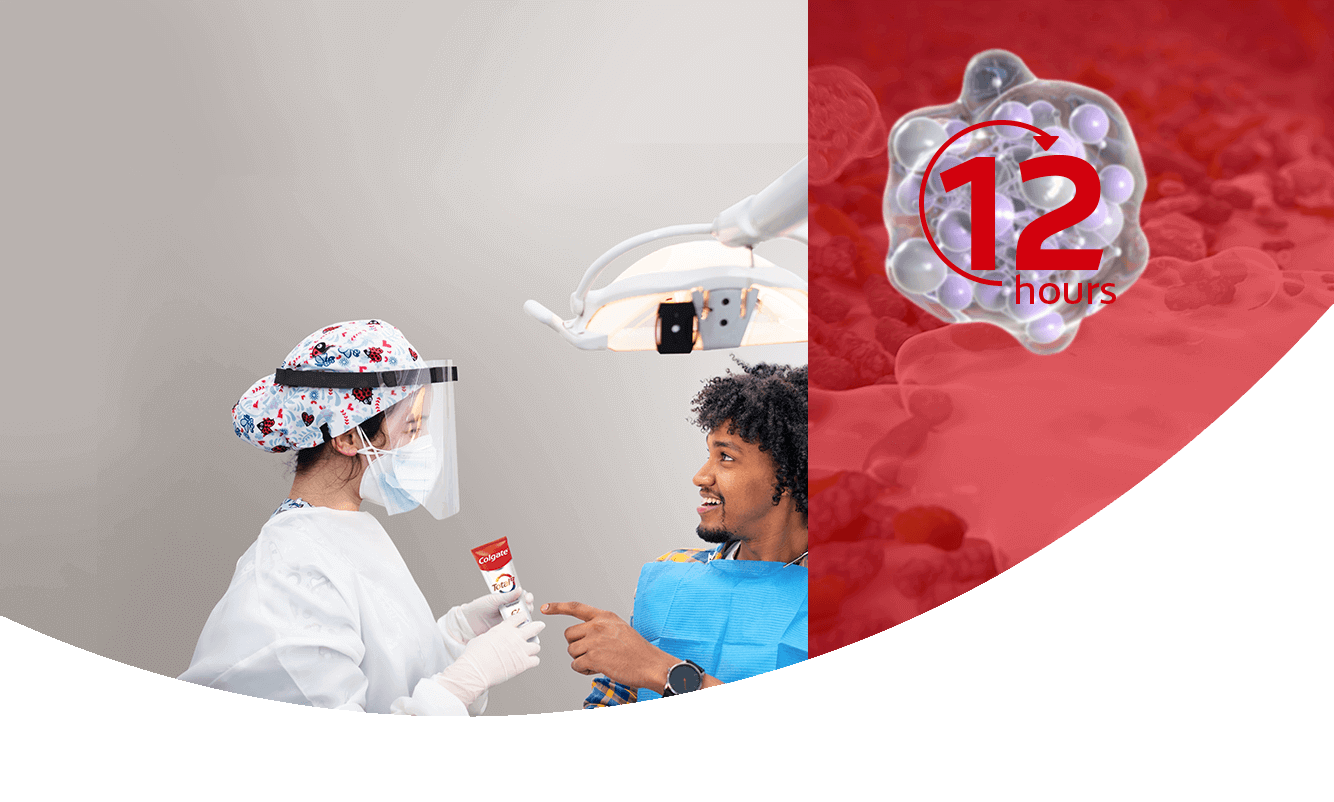 Dental professional showing colgate total 12 toothpaste to a patient