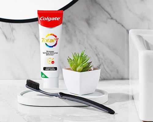 Colgate SlimSoft Charcoal Toothbrush with Colgate Total Plaque Release Toothpaste