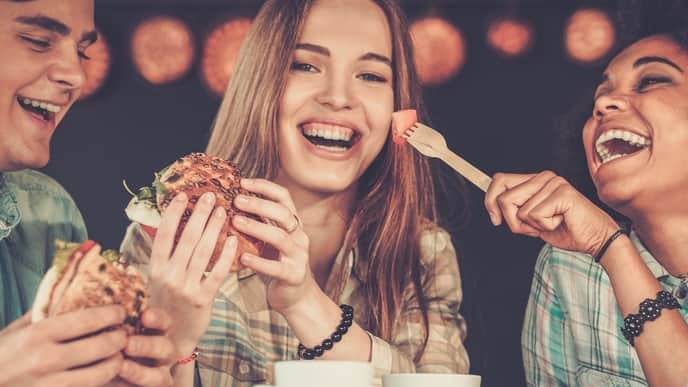 Young people eating together