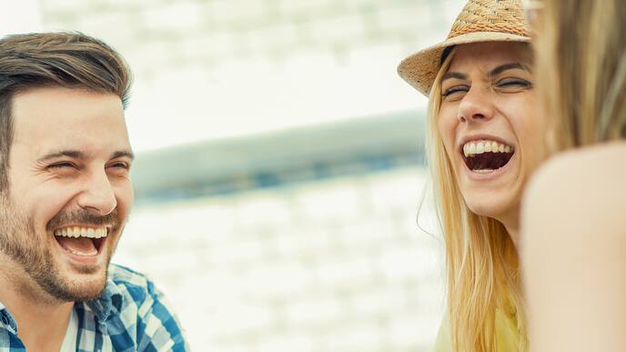 Smiling friends showing teeth