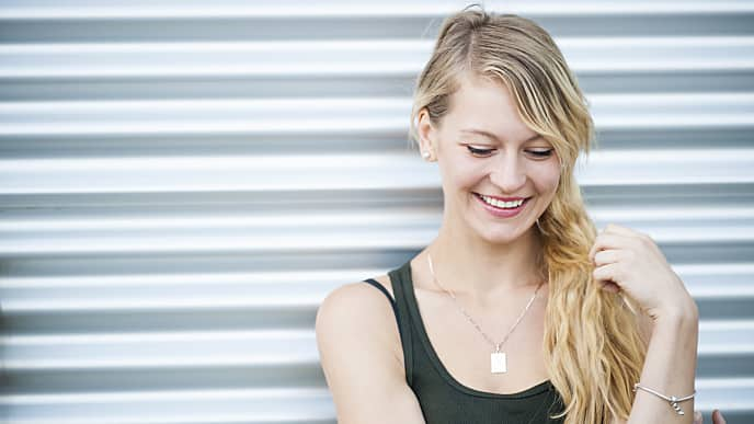 Lady benefiting from using white ceramic braces