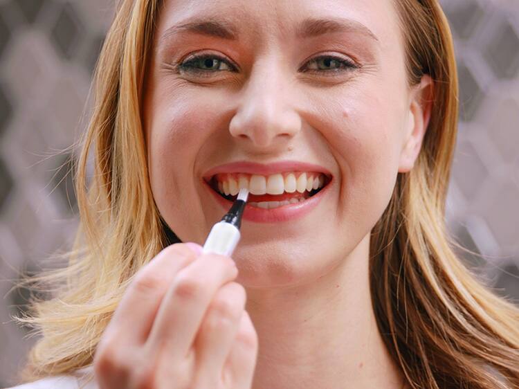 Woman Using Express Whitening Pen