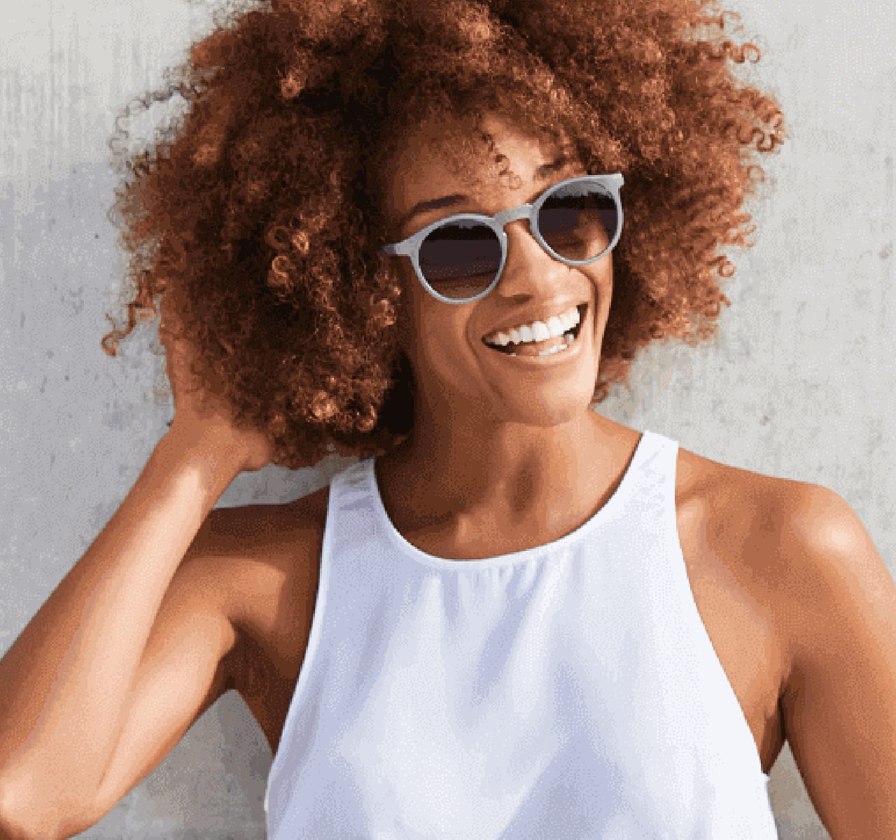 Woman with sun glasses smiling
