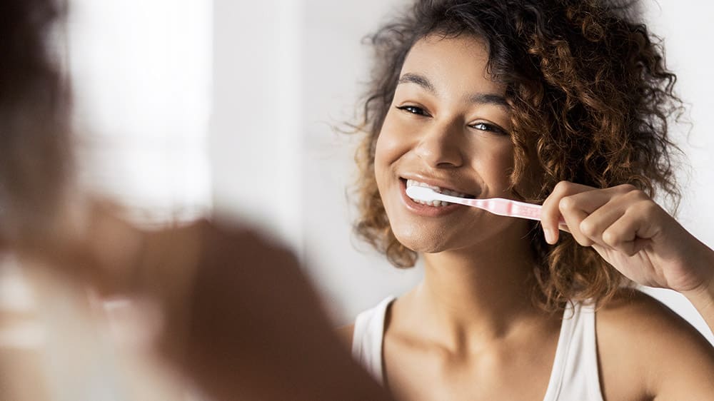 Brush your teeth at least twice a day or as directed by a dentist or dental hygienist.