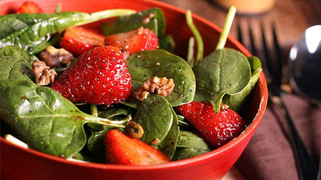 A bowl with fruit and veggies 