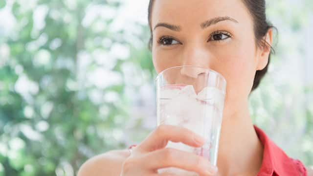 Woman drinking glass of water