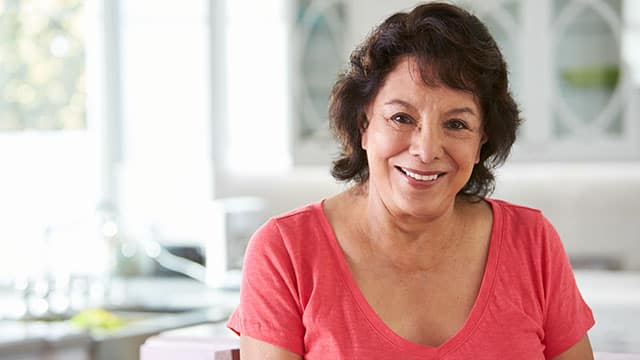 Middle age woman smiling indoors