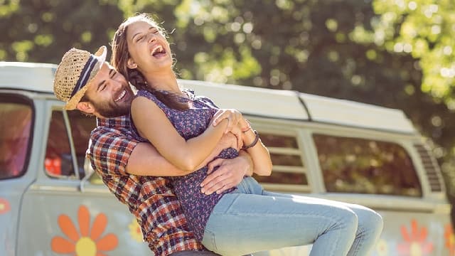 a couple is happy after finding out how to fix brown spots on teeth