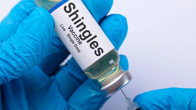 Doctor filling a shingles vaccine.