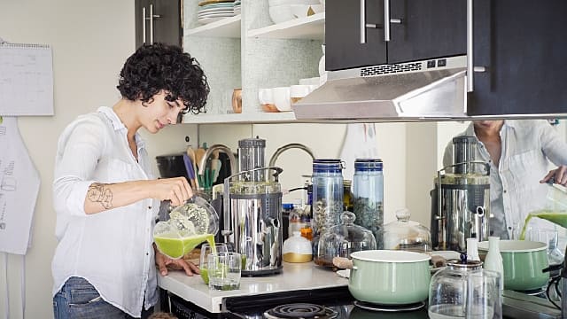 Person making a meal after tooth extraction