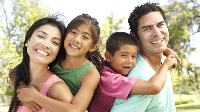 a family is happy after finding a good family dental group