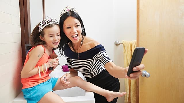 mother and daughter taking picture together