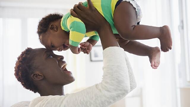 mother is playing with her baby after using teeth biscuits