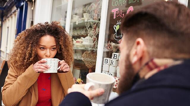 two friends are drinking coffee together after tooth infection treatment