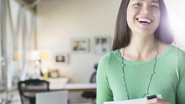 woman smiling brightly at the office