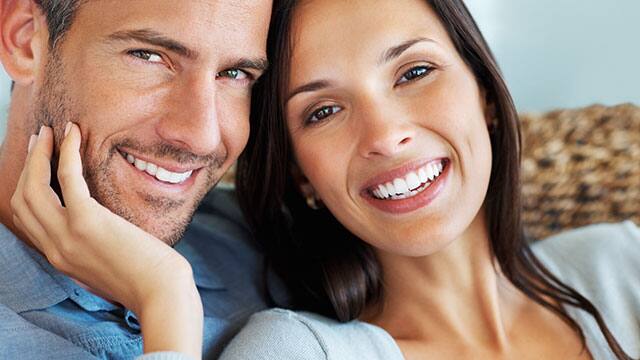 Close up of the couple's faces smiling