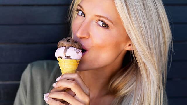 A woman eating an ice cream