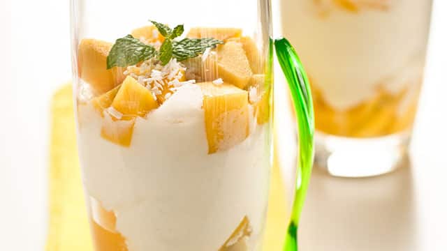 Two glasses with yogurt and fruits